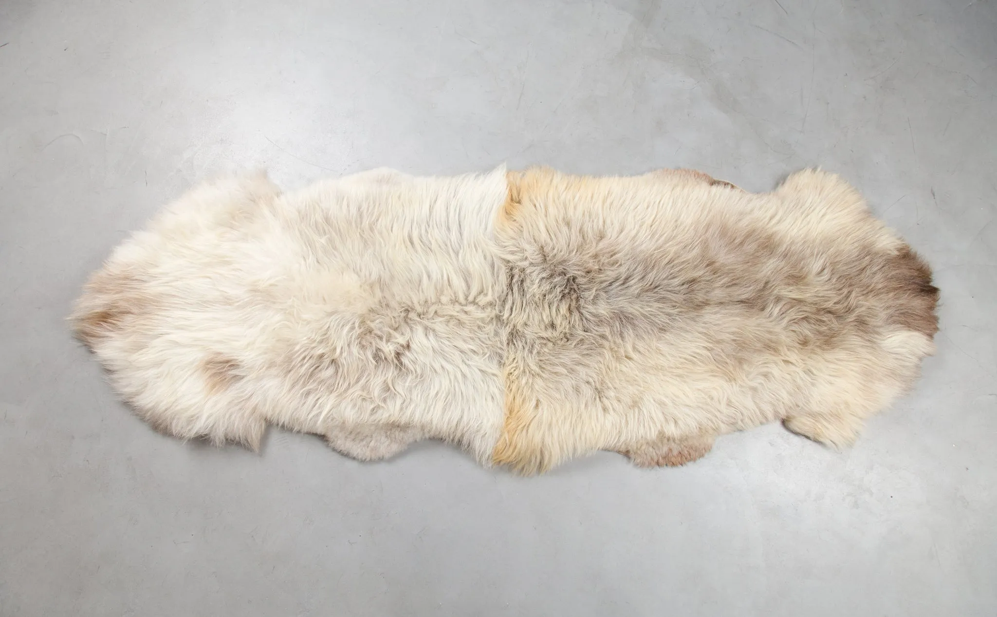 Rug made of two natural sheepskin hides