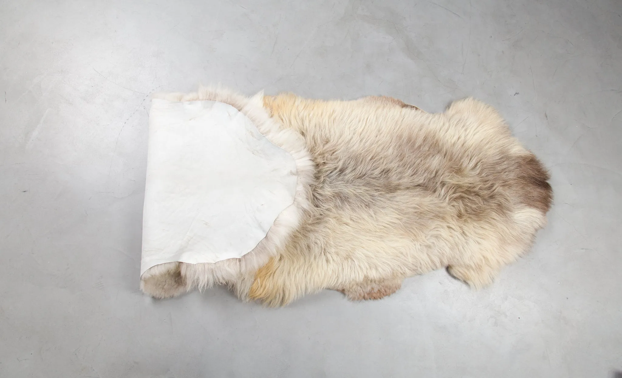 Rug made of two natural sheepskin hides